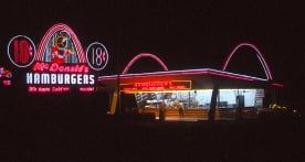Vintage McDonald's restaurant and neon road sign